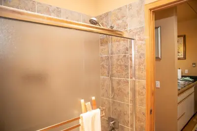 a shower with a glass door in a bathroom at 1934 Soda Springs condo in Dillon