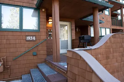 a front porch of a house with a sign on it at 1934 Soda Springs condo in Dillon