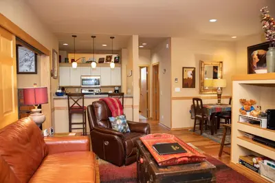 a living room with a couch and a table at 1934 Soda Springs condo in Dillon