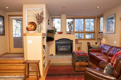 a living room with a couch and a fireplace at 1934 Soda Springs condo in Dillon