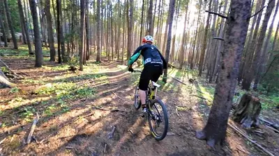 a person riding a bike in the woods at Deming Crossing Duplex: Downtown Frisco Chic in Frisco