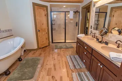 a bathroom with two sinks and a tub and a shower at Bear Creek Mining Lodge: Mountain Style, Hot Tub in Breckenridge Airport