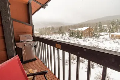a balcony with a view of a snow covered mountain at Mountainside Snowview Condo : Cool Frisco Location in Frisco