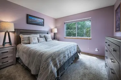 a bedroom with a large bed and a window at Blue Granite Off Main Townhome: Updated, Great Location in Frisco
