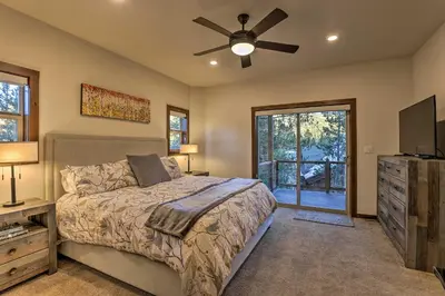 a bedroom with a bed and a ceiling fan at Mountain View Retreat, Walk to Winter Park Gondola in Winter Park