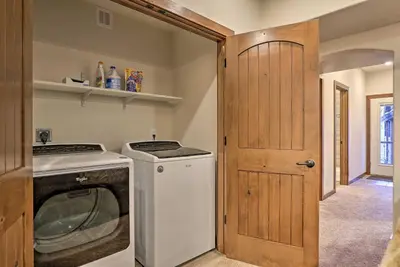 a small laundry room with a washer and dryer at Mountain View Retreat, Walk to Winter Park Gondola in Winter Park