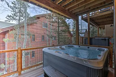 a hot tub on the deck of a house at Mountain View Retreat, Walk to Winter Park Gondola in Winter Park