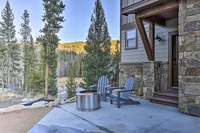 two chairs and a table on a patio with a view at Mountain View Retreat, Walk to Winter Park Gondola in Winter Park