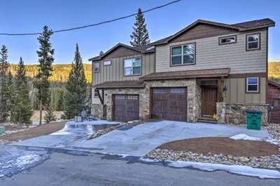 a house with a garage and a driveway at Mountain View Retreat, Walk to Winter Park Gondola in Winter Park