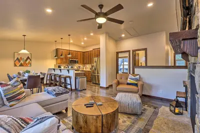 a living room with a couch and a table at Mountain View Retreat, Walk to Winter Park Gondola in Winter Park