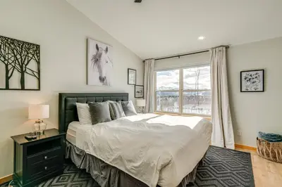 a bedroom with a large bed and a window at 8 Mi to Keystone Mtn-View Ski Retreat! in Silverthorne