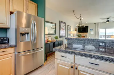 a large kitchen with a stainless steel refrigerator at 8 Mi to Keystone Mtn-View Ski Retreat! in Silverthorne