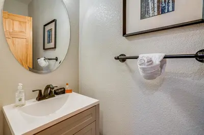 a bathroom with a sink and a mirror at 8 Mi to Keystone Mtn-View Ski Retreat! in Silverthorne