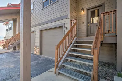 a staircase leading to a house with a garage at 8 Mi to Keystone Mtn-View Ski Retreat! in Silverthorne