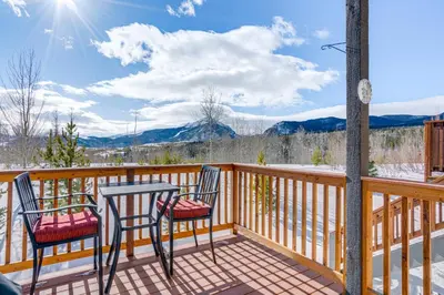 two chairs and a table on a deck with mountains at 8 Mi to Keystone Mtn-View Ski Retreat! in Silverthorne