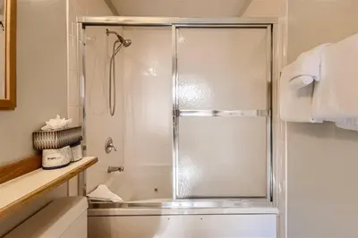 a shower with a glass door in a bathroom at Cabin Creek Condos C-1 condo in Frisco