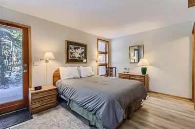 a bedroom with a large bed and a window at Cabin Creek Condos C-1 condo in Frisco