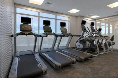 a row of treadmills in a gym at Fairfield by Marriott Inn & Suites Denver Airport at Gateway Park in Denver