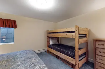 a bedroom with a bunk bed in a room at Saddle Ridge in Silverthorne