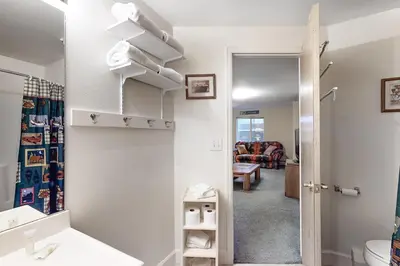 a bathroom with a sink and a mirror at Saddle Ridge in Silverthorne