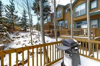 a snow scooter parked in front of a house at Saddle Ridge in Silverthorne