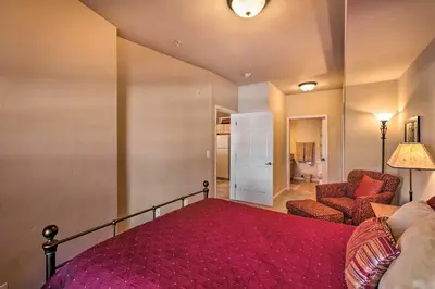 a bedroom with a bed and a couch and a chair at Fraser Condo 5 Miles to Winter Park Resort! in Fraser