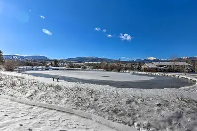 a frozen river with snow on the ground at Fraser Condo 5 Miles to Winter Park Resort! in Fraser