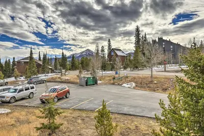 a parking lot with two cars parked in it at Ski and Hike Mtn-View Condo in Silverthorne! in Silverthorne
