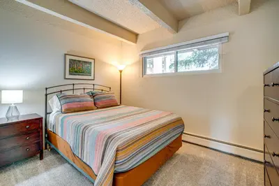a bedroom with a bed and a window at 2 Blocks to Main St Downtown Frisco Condo! in Frisco