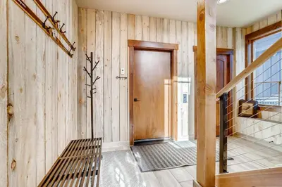 a hallway with wooden walls and a wooden door at Estates on Galena #8 townhouse in Frisco