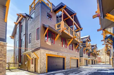 a house with a wooden facade with a garage at Estates on Galena #8 townhouse in Frisco