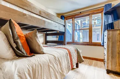 a bedroom with a bunk bed and a window at Estates on Galena #8 townhouse in Frisco