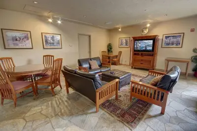 a living room with a couch and a table and chairs at 5016 Gateway condo in Keystone