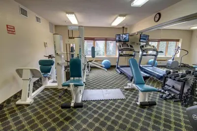 a gym with chairs and equipment in a room at 5016 Gateway condo in Keystone