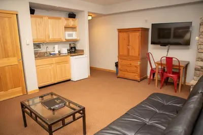 a living room with a couch and a table at 5016 Gateway condo in Keystone