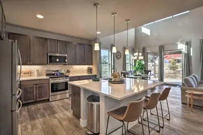 a kitchen with a large island in the middle of a room at Ski and Hike Home with Hot Tub and Gas Grill in Granby in Granby