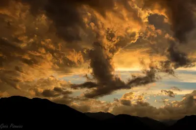 a cloud explosion in the sky at sunset at River Rock Retreat -- EV #6032 condo in Estes Park