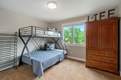 a bedroom with a bunk bed next to a dresser at Outstanding Home, Incredible Views, Near Reservoir in Fort Collins
