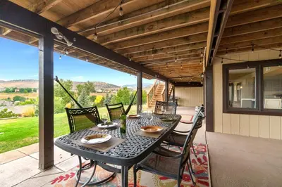 a black table and chairs on a patio at Outstanding Home, Incredible Views, Near Reservoir in Fort Collins