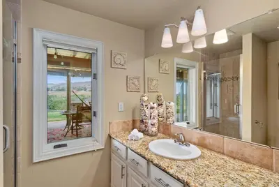a bathroom with a sink and a large mirror at Outstanding Home, Incredible Views, Near Reservoir in Fort Collins