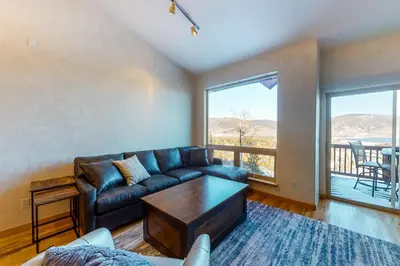 a living room with a couch and a table at Prospector Village 105C in Silverthorne