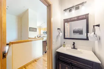 a bathroom with a sink and a mirror at Prospector Village 105C in Silverthorne