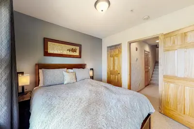 a bedroom with a large bed in a room at Prospector Village 105C in Silverthorne