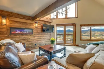 a living room with leather couches and a tv at Mountain Adventure Home Base - Ski, Hike and Chill! in Fraser