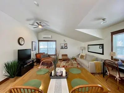 a living room with a couch and a tv at The Beautiful Bears Den! Walk to Old Town and CSU! in Fort Collins