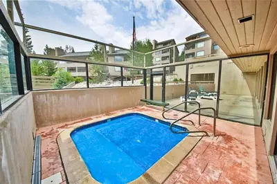 a swimming pool on the balcony of a building at Snowblaze Condominiums C14 in Winter Park