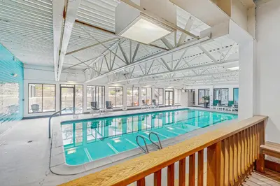 a large swimming pool in a building at Snowblaze Condominiums C14 in Winter Park