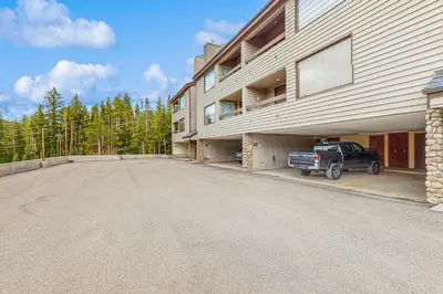 an empty parking lot in front of a building at Snowblaze Condominiums C14 in Winter Park