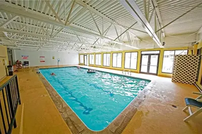 a large swimming pool in a large room at Snowblaze Condominiums C14 in Winter Park