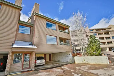 a house with a car parked in front of it at Snowblaze Condominiums C14 in Winter Park
